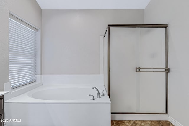 bathroom featuring vanity and a bath