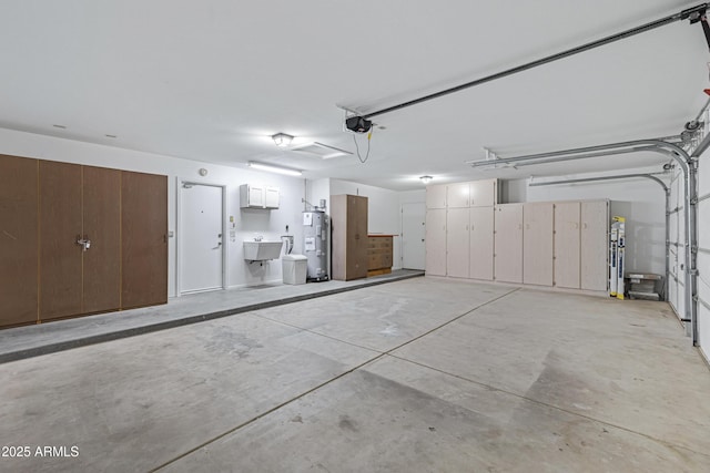 garage with a garage door opener, a sink, and electric water heater