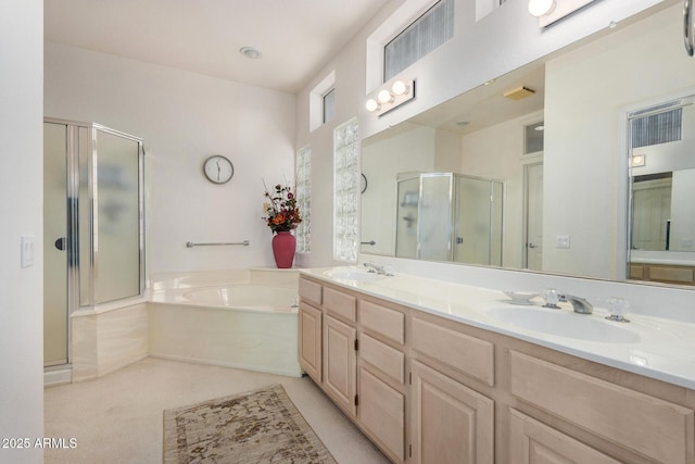 bathroom with vanity and independent shower and bath