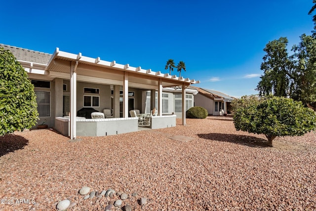 back of house with a patio area