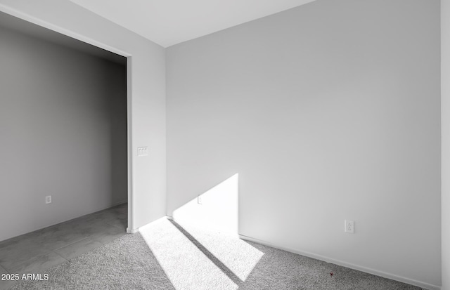 empty room featuring light carpet