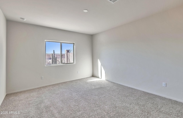 spare room featuring carpet flooring