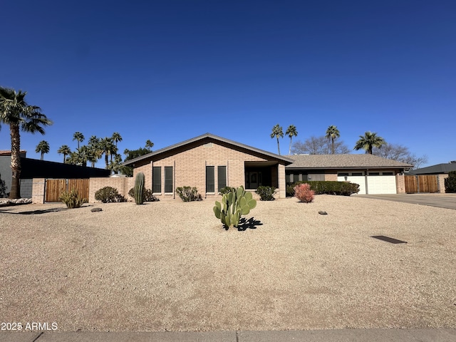 ranch-style home with a garage