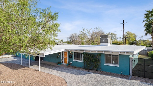 view of front of property featuring fence