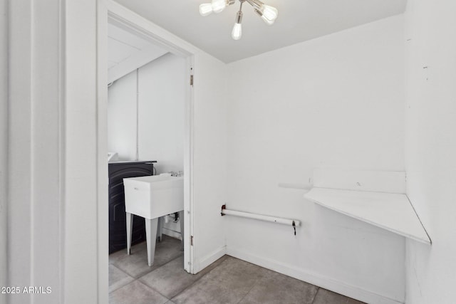 washroom with baseboards