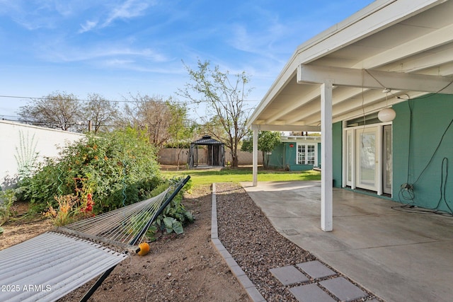 view of yard featuring a gazebo, a fenced backyard, and a patio area