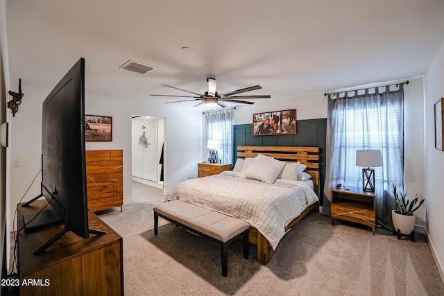 bedroom featuring multiple windows, light carpet, and visible vents