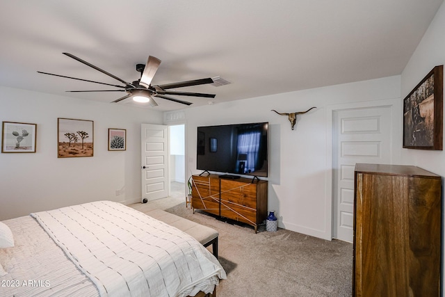 bedroom with baseboards, light carpet, a ceiling fan, and visible vents