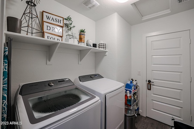 laundry room with laundry area, attic access, visible vents, dark wood-style floors, and washer and clothes dryer