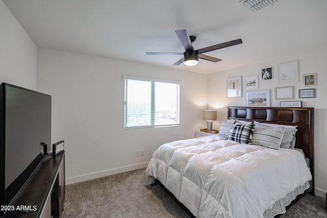carpeted bedroom featuring visible vents, a ceiling fan, and baseboards