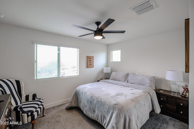 bedroom featuring baseboards, ceiling fan, carpet, and visible vents