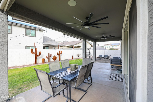 view of patio with a fenced backyard, outdoor dining space, and ceiling fan