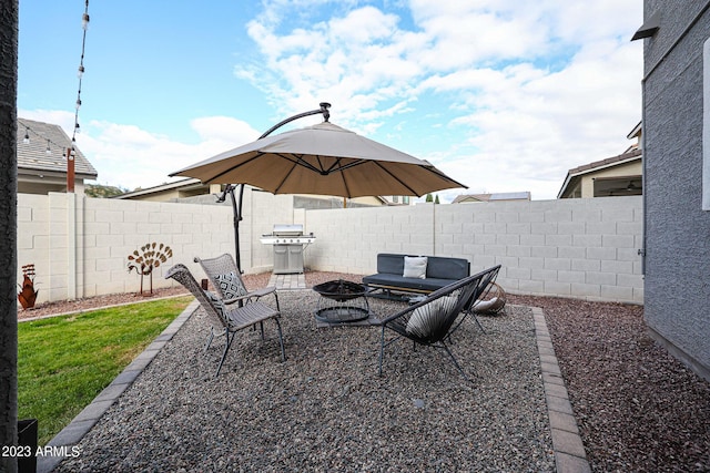view of patio / terrace featuring a fire pit and a fenced backyard