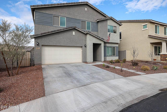 traditional home with fence, stucco siding, and concrete driveway