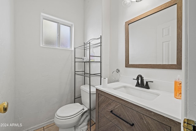 bathroom with tile patterned floors, toilet, and vanity