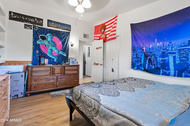 bedroom with ceiling fan and wood-type flooring