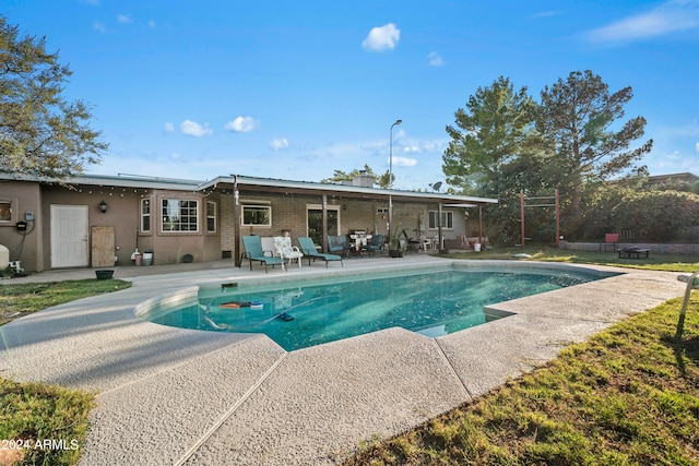 view of pool featuring a patio