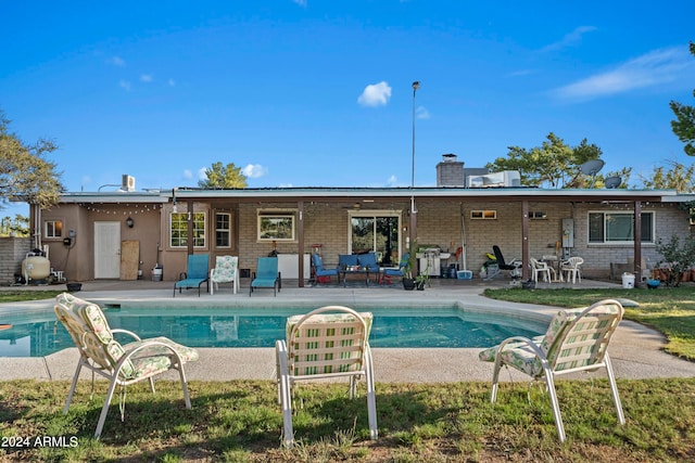 rear view of property featuring a patio area