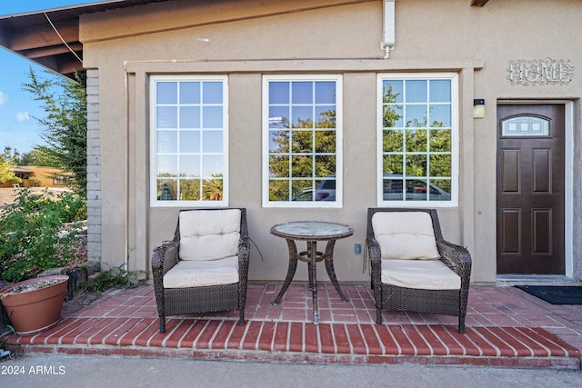 entrance to property featuring a patio area