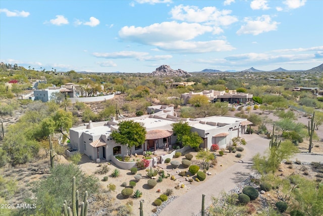 drone / aerial view featuring a mountain view