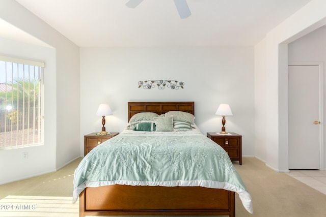 carpeted bedroom with ceiling fan