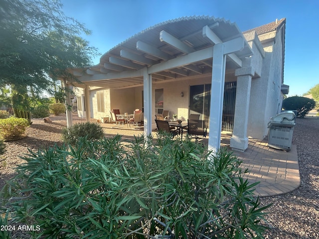 view of patio featuring a pergola