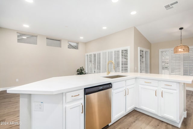 kitchen featuring light hardwood / wood-style flooring, sink, decorative light fixtures, stainless steel dishwasher, and white cabinetry