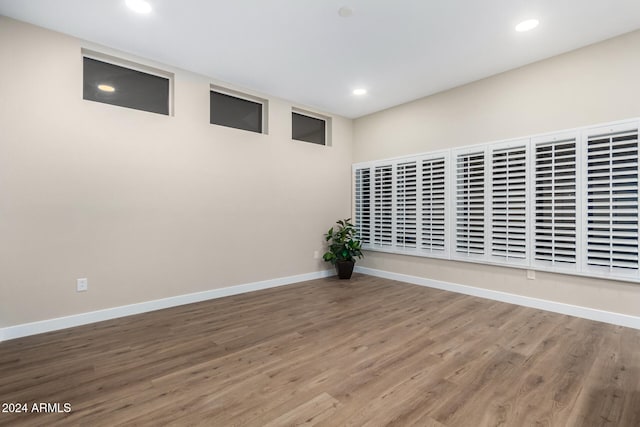 empty room with wood-type flooring