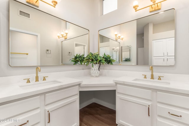 bathroom featuring vanity and wood-type flooring