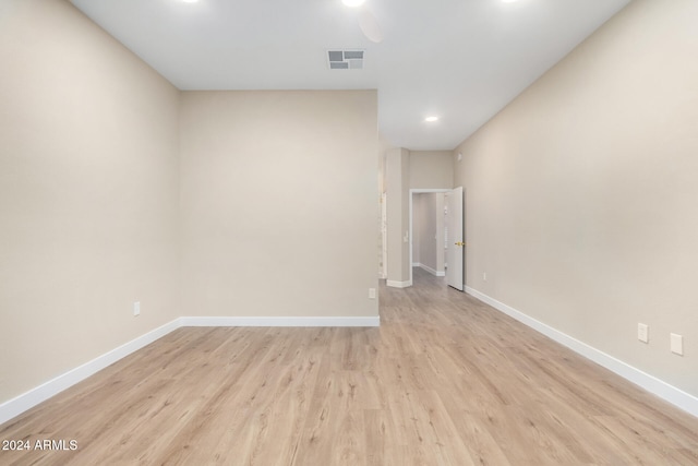 spare room with light wood-type flooring