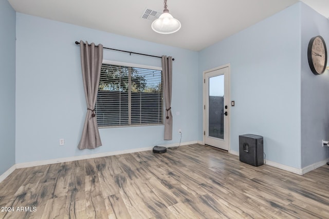 unfurnished room featuring hardwood / wood-style flooring