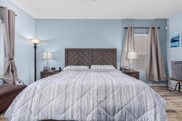 bedroom with light hardwood / wood-style flooring