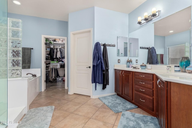 bathroom featuring tile patterned flooring and vanity