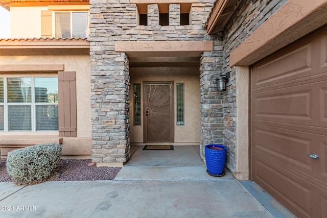 property entrance with a garage