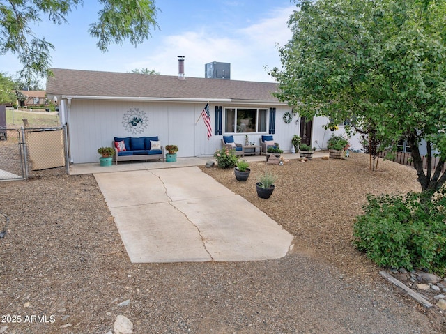 6289 E Duchess Dr, Prescott Valley, AZ 86314 - ranch-style home featuring outdoor lounge area, a patio, and a shingled roof