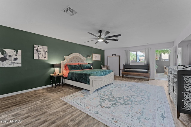 6289 E Duchess Dr, Prescott Valley, AZ 86314 - bedroom featuring wood finished floors, baseboards, and a ceiling fan
