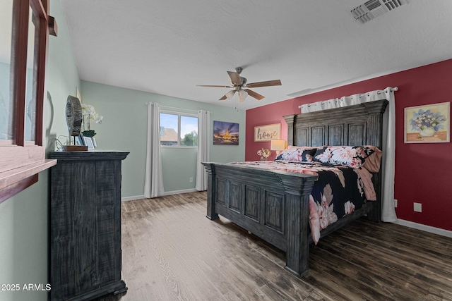 6289 E Duchess Dr, Prescott Valley, AZ 86314 - bedroom featuring wood finished floors, baseboards, and ceiling fan