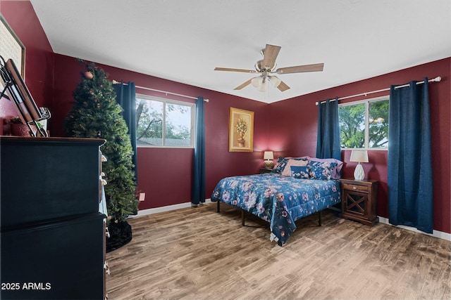 6289 E Duchess Dr, Prescott Valley, AZ 86314 - bedroom with wood finished floors, baseboards, and a ceiling fan