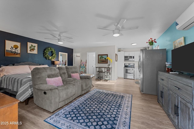 6289 E Duchess Dr, Prescott Valley, AZ 86314 - bedroom featuring stainless steel refrigerator with ice dispenser, a wall unit AC, light wood-type flooring, and a ceiling fan