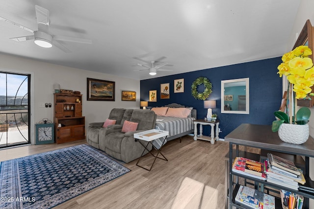 6289 E Duchess Dr, Prescott Valley, AZ 86314 - bedroom with wood finished floors, access to outside, and a ceiling fan