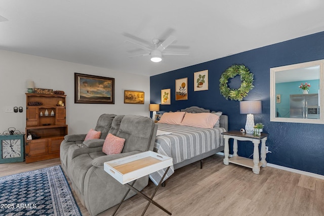 6289 E Duchess Dr, Prescott Valley, AZ 86314 - bedroom featuring stainless steel fridge with ice dispenser, wood finished floors, baseboards, and a ceiling fan