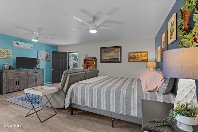 6289 E Duchess Dr, Prescott Valley, AZ 86314 - bedroom featuring a wall mounted air conditioner, light wood-style flooring, and ceiling fan