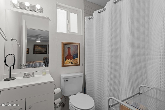 6289 E Duchess Dr, Prescott Valley, AZ 86314 - ensuite bathroom featuring vanity, toilet, ceiling fan, and a shower with curtain