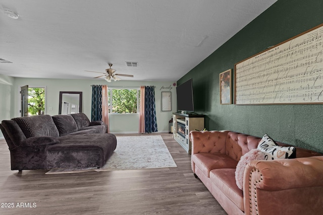 6289 E Duchess Dr, Prescott Valley, AZ 86314 - living area with wood finished floors and a ceiling fan