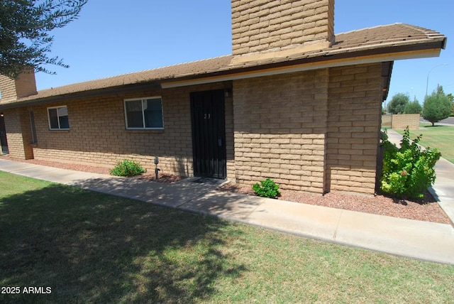 2015 E Southern Ave Unit 23, Tempe, AZ 85282 - view of front of home featuring a chimney and a front yard