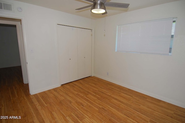 2015 E Southern Ave Unit 23, Tempe, AZ 85282 - unfurnished bedroom featuring light wood-type flooring, a closet, and a ceiling fan
