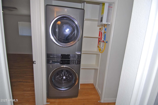2015 E Southern Ave Unit 23, Tempe, AZ 85282 - laundry area with stacked washer and clothes dryer and wood finished floors