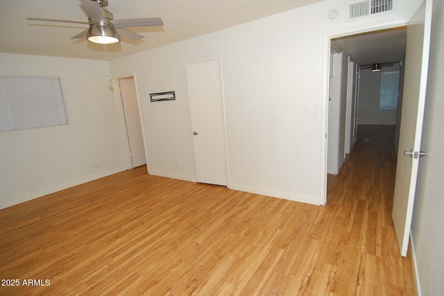 2015 E Southern Ave Unit 23, Tempe, AZ 85282 - empty room featuring light wood finished floors and ceiling fan