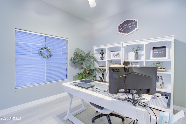 office with wood finished floors, a ceiling fan, and baseboards