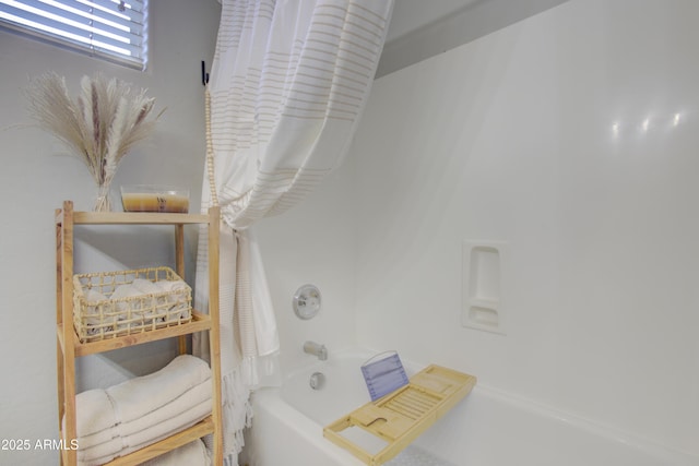 bathroom featuring shower / bathtub combination with curtain